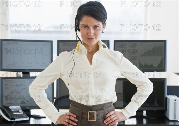 Female trader looking at camera.