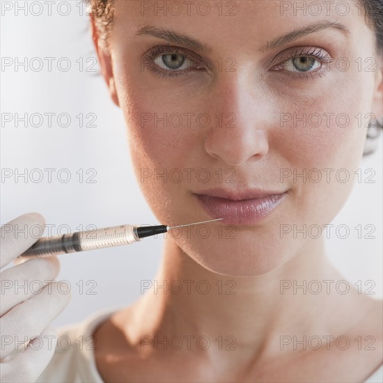 Woman with syringe.