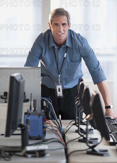 Man with networked computers.