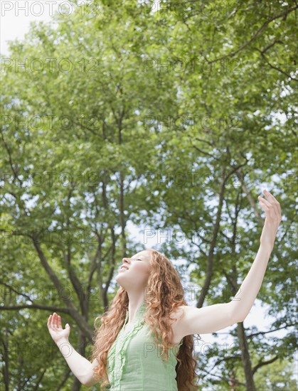 Woman under trees