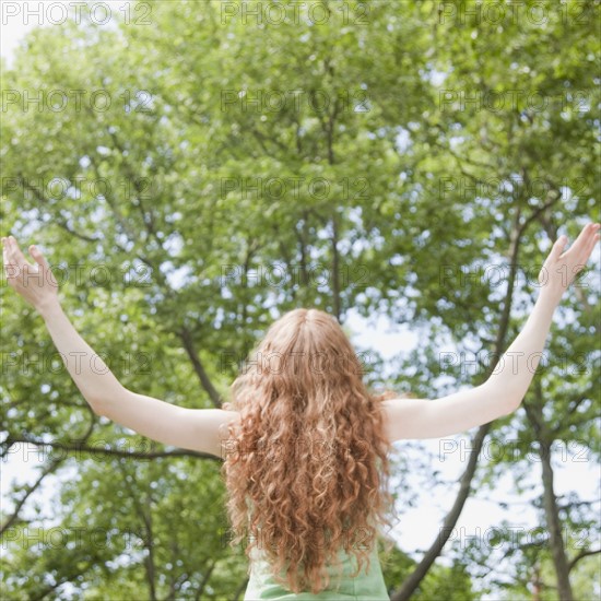 Woman under trees