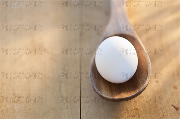 Egg in spoon.