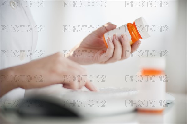 Woman reading medical label.
