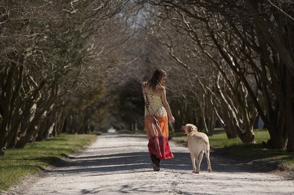 Woman walking dog