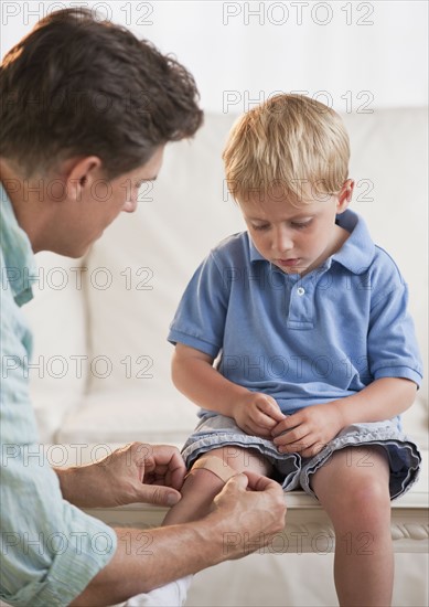 Father treating childs injury.