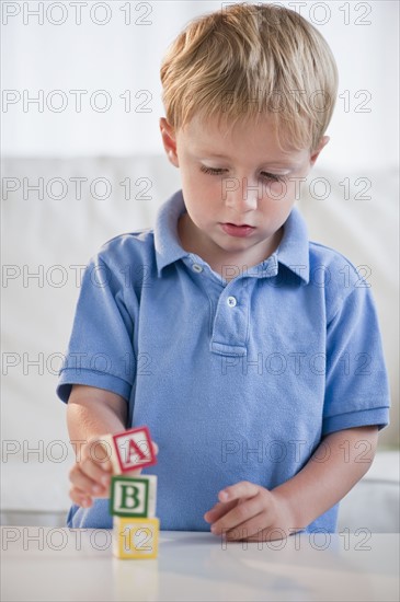 Child playing with ABC blocks.