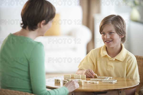 Mother playing game with child.