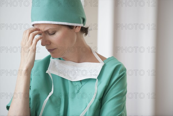 Female doctor in thought.