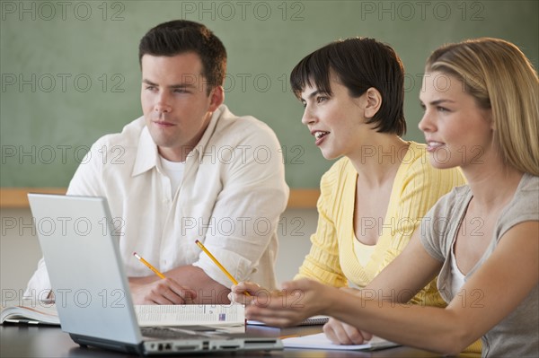 Classmates studying.