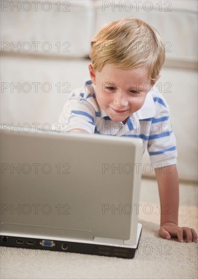 Child playing on computer.