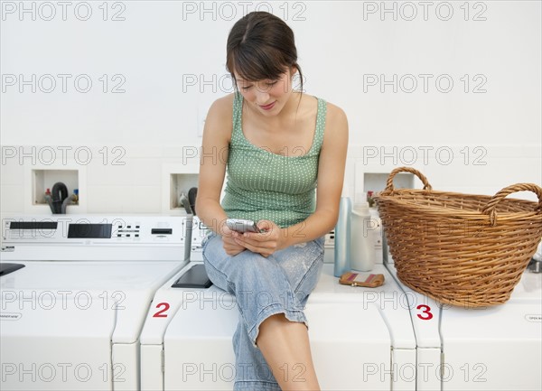 Woman in laundromat.