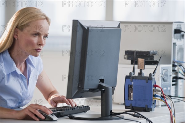 Woman working on computer.