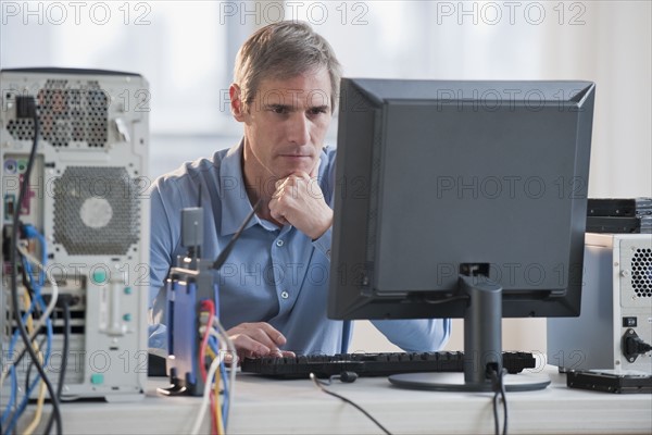 Man working on computer.
