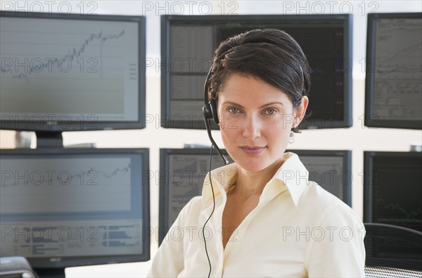 Female trader looking at camera.