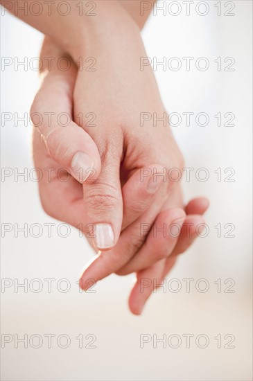 Couple holding hands.