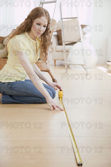 Woman measuring room