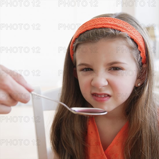 Child turning up nose to medicine