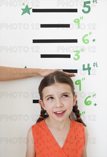Child having height measured