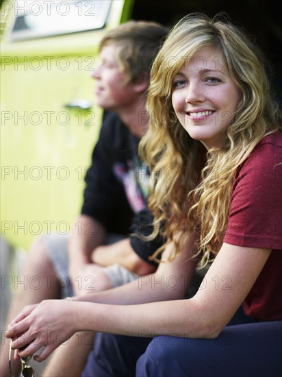 Couple in back of vehicle