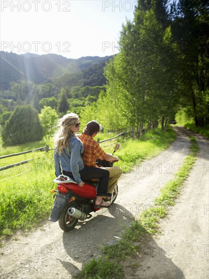 Young couple on scooter