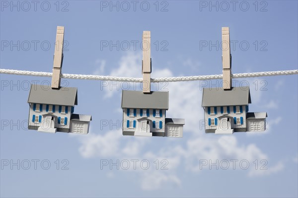 Symbolic houses on clothes line