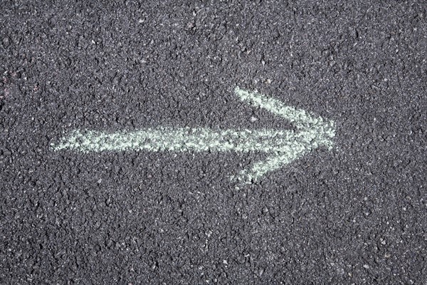 Arrow pointing right on pavement