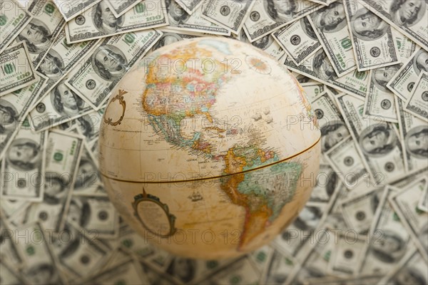 Globe on US dollars background