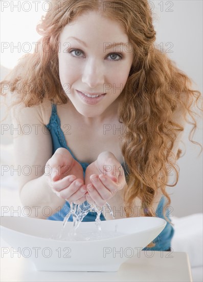 Woman washing face