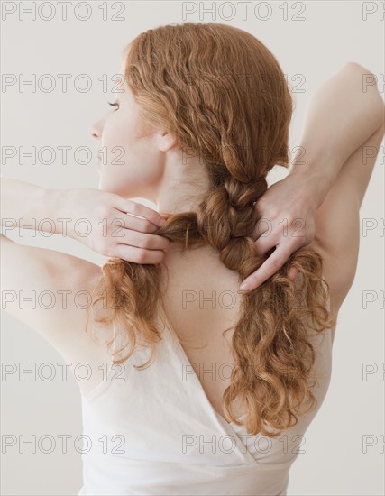 Woman fixing hair