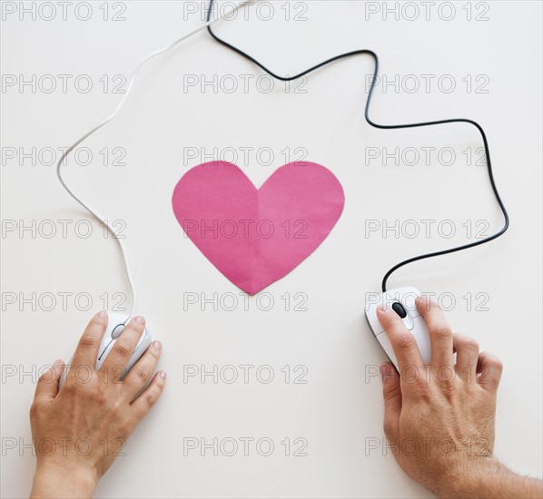 Two computer mice with heart.