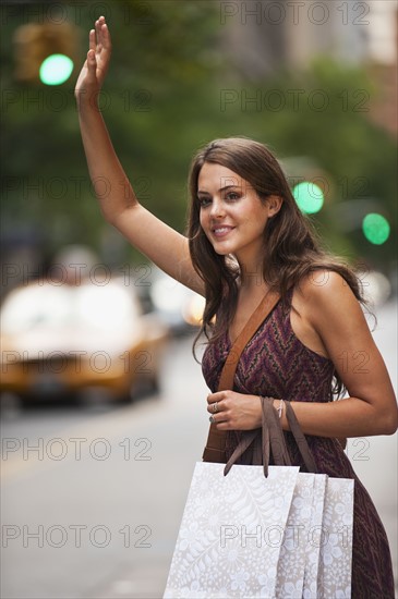 Woman hailing cab