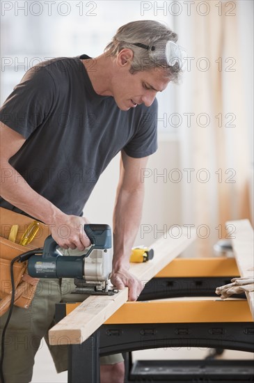 Male carpenter working.