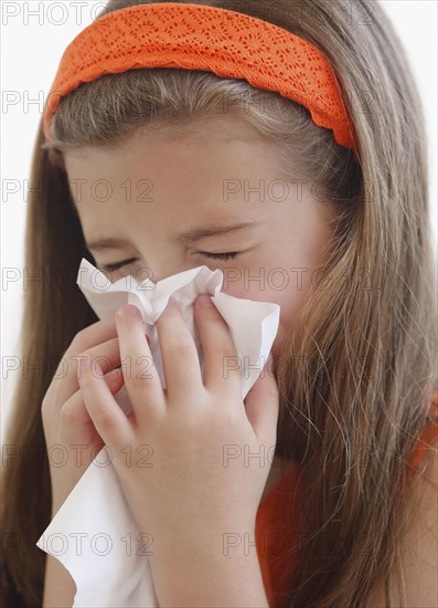 Child blowing nose