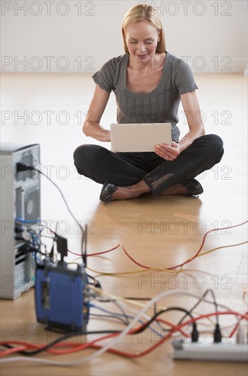 Women sitting while working on computer.