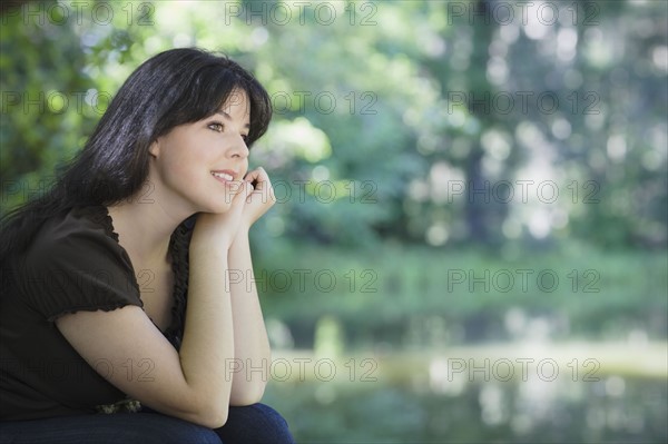 Young woman smiling in forest