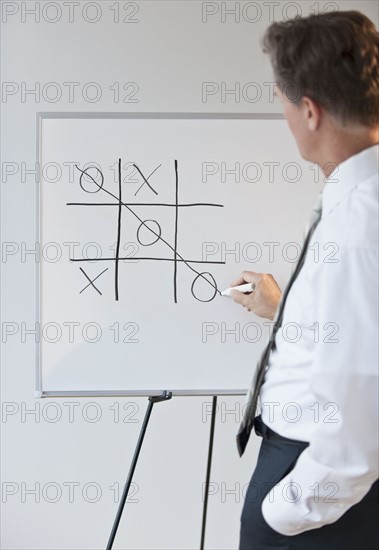 Businessman drawing concept for winning.