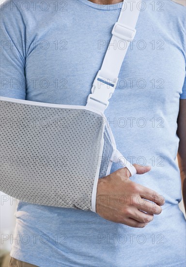 Man with arm in sling.