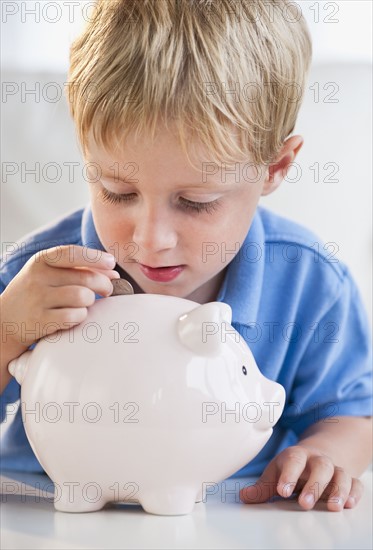 Child with piggybank.