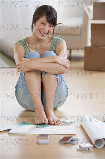 Woman looking at plans.