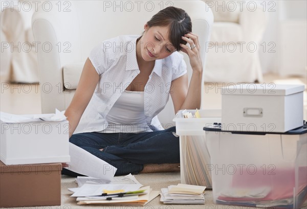 Woman organizing papers.