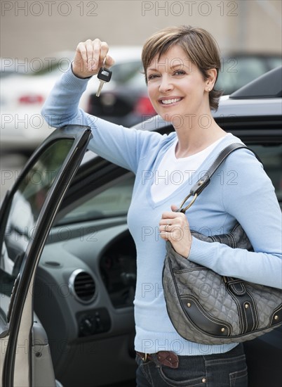 Woman shopping for car.