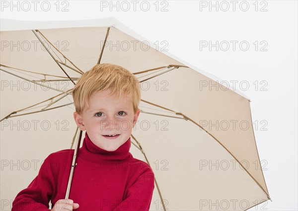 Child with umbrella.