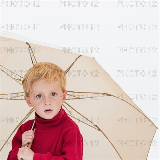 Child with umbrella.