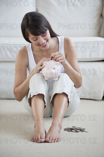 Woman with piggy bank.