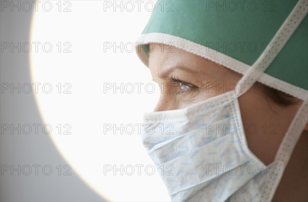 Female doctor with surgical mask.