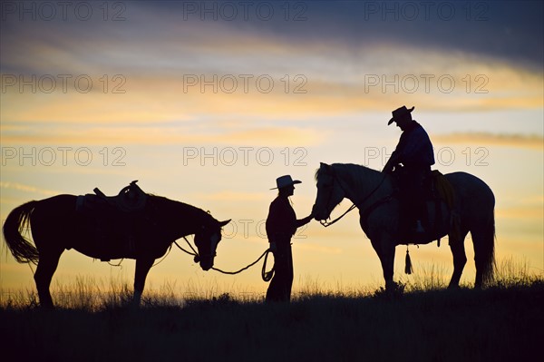 Horseback riders.