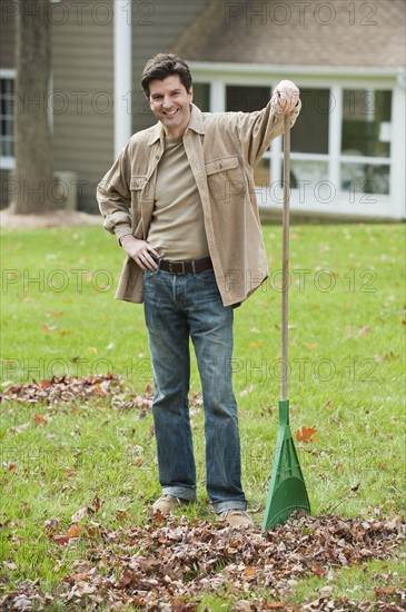 Man raking leaves.