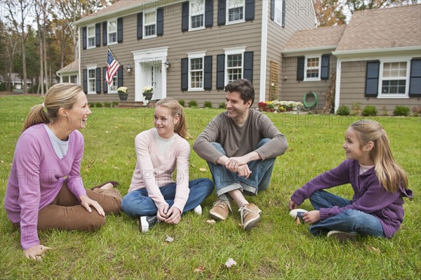 Family in front of house.