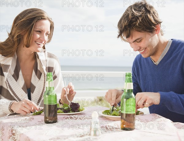 Couple eating at the beach