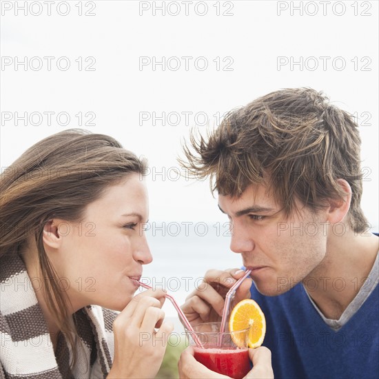 Couple sharing drink